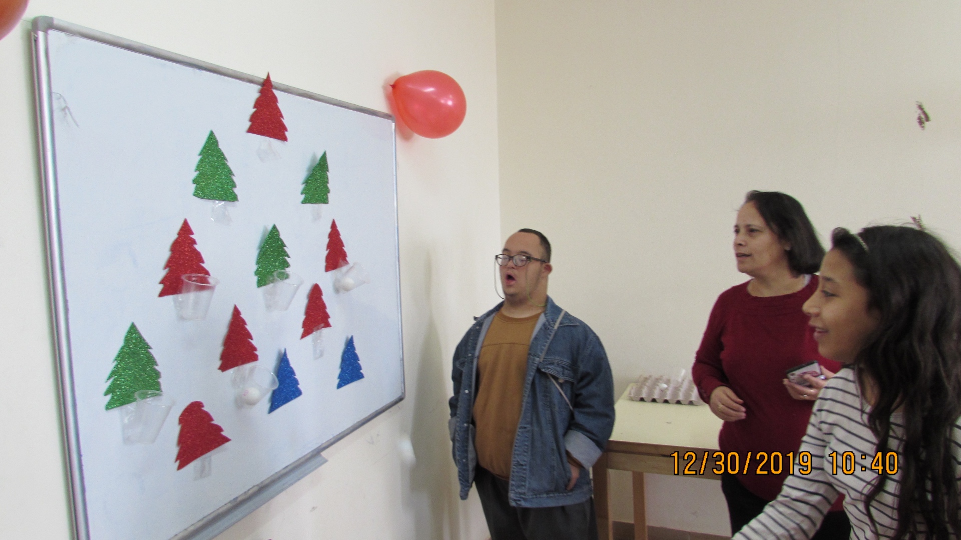 Children at a Theodora center celebrating with handmade decorations